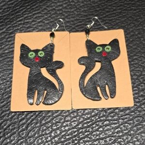 Genuine leather black cat earrings embossed.
Handmade brand new